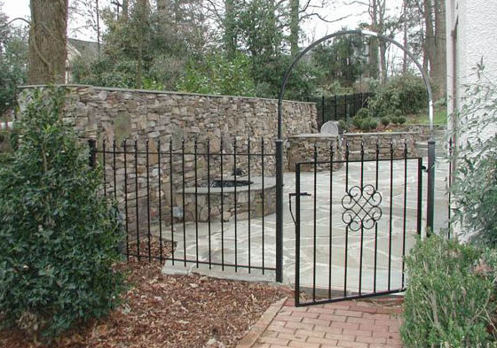 brick walkway gate built in grill berm stone wall